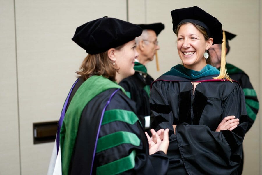 Faculty COMP-Northwest faculty chatting prior to the ceremony